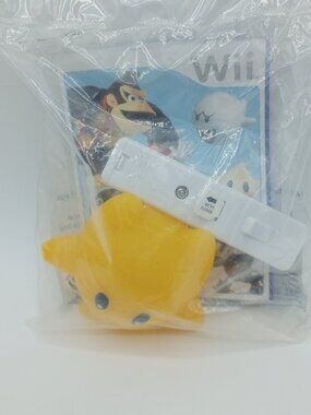 2008 Sealed Super Mario Galaxy Light Up Luma Mini Remote & Booklet - Burger King